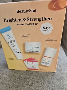 BeautyStat Travel Starter Set in peach and white with blue accents